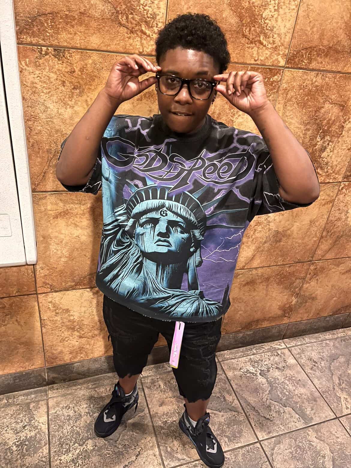 Booga Brim portrait in Godspeed Statue of Liberty t-shirt, glasses pose