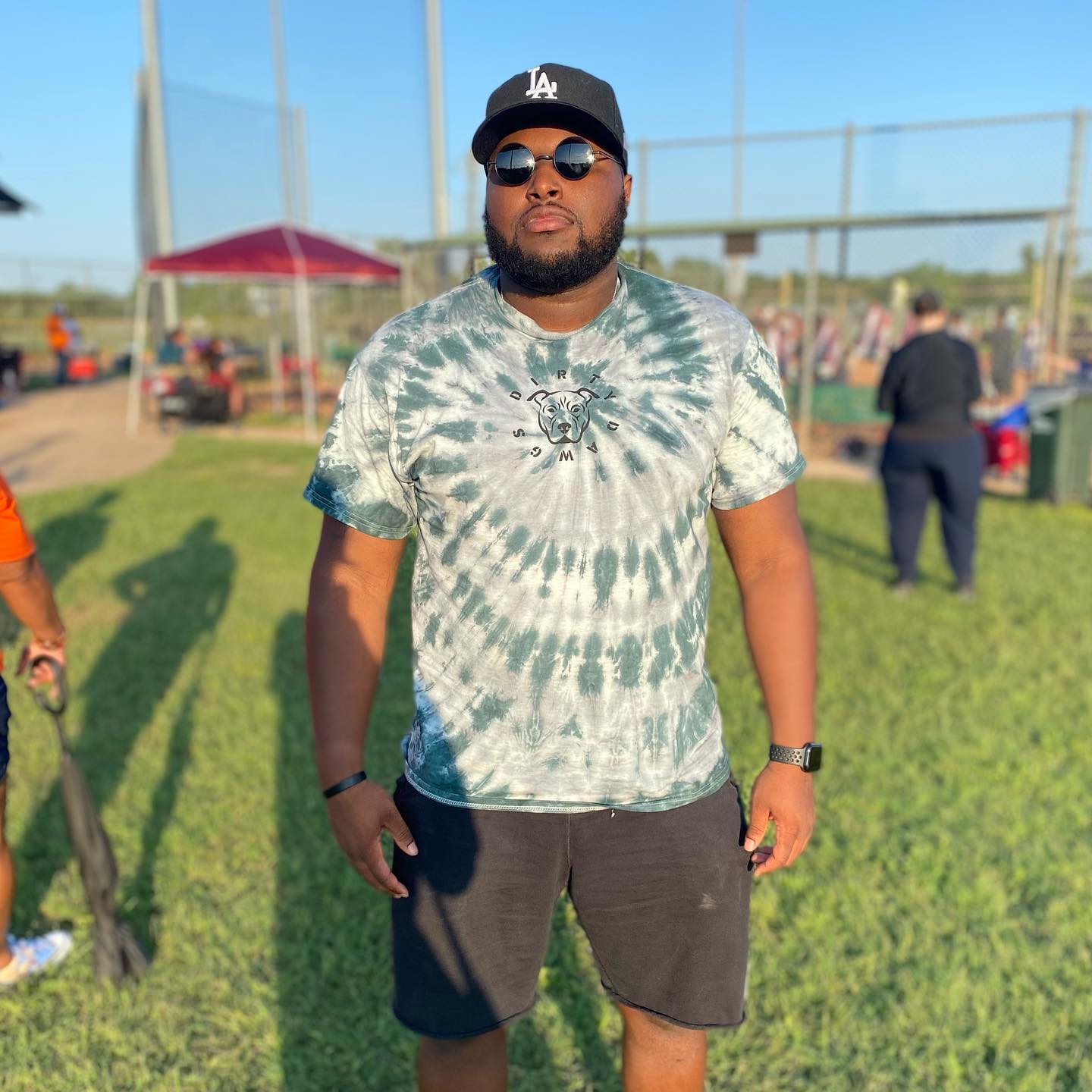 A fan repping a Dirty Dawgs tie-dye tee in Austin