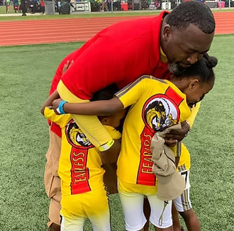 Austin Honey Badgers coach and young athletes