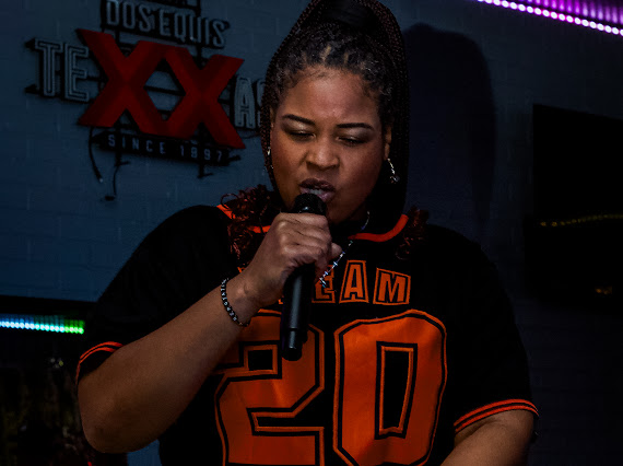 Dream performing live with microphone in Austin venue