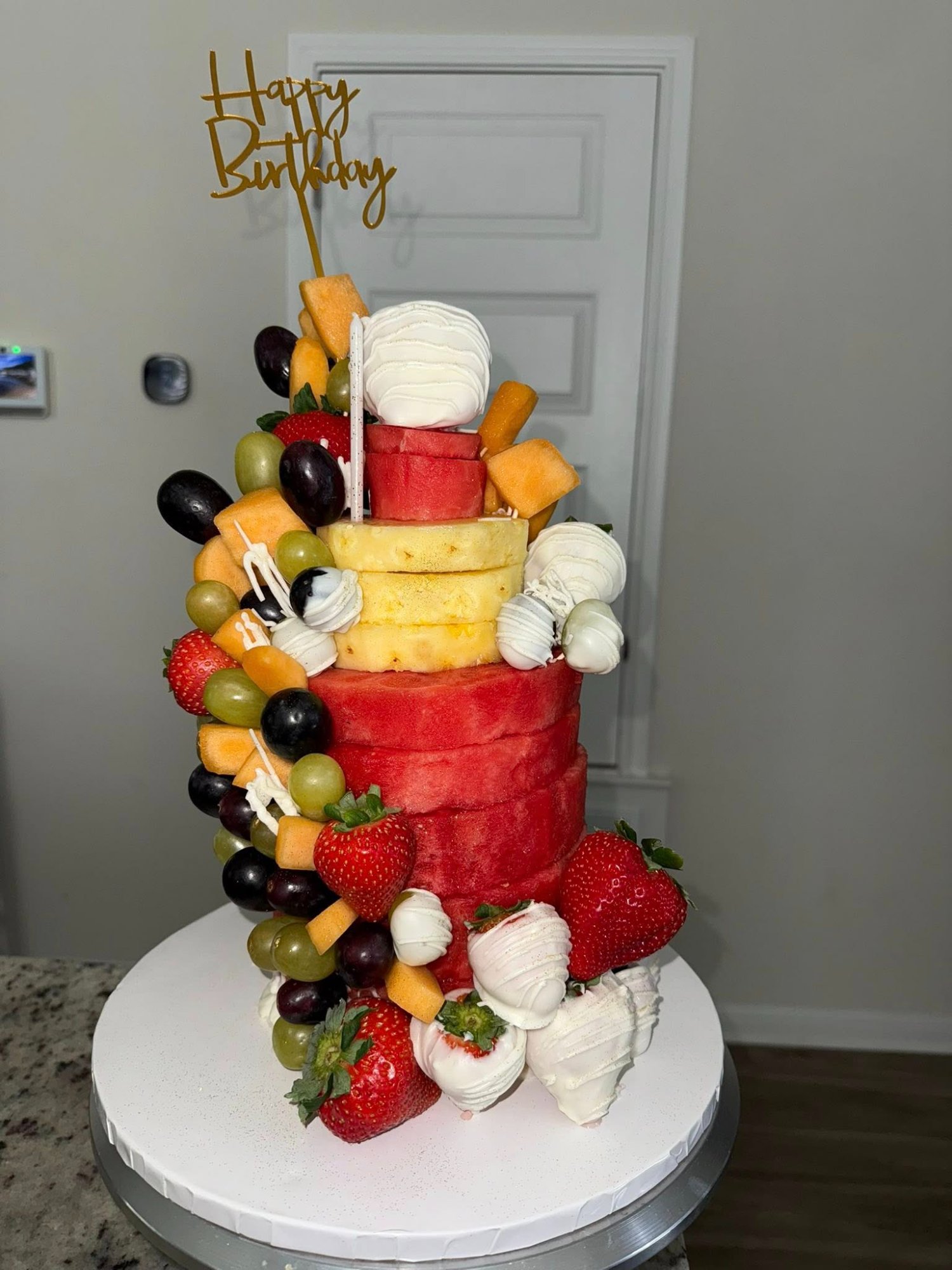 A Poindexter Confections custom fruit dessert cake
